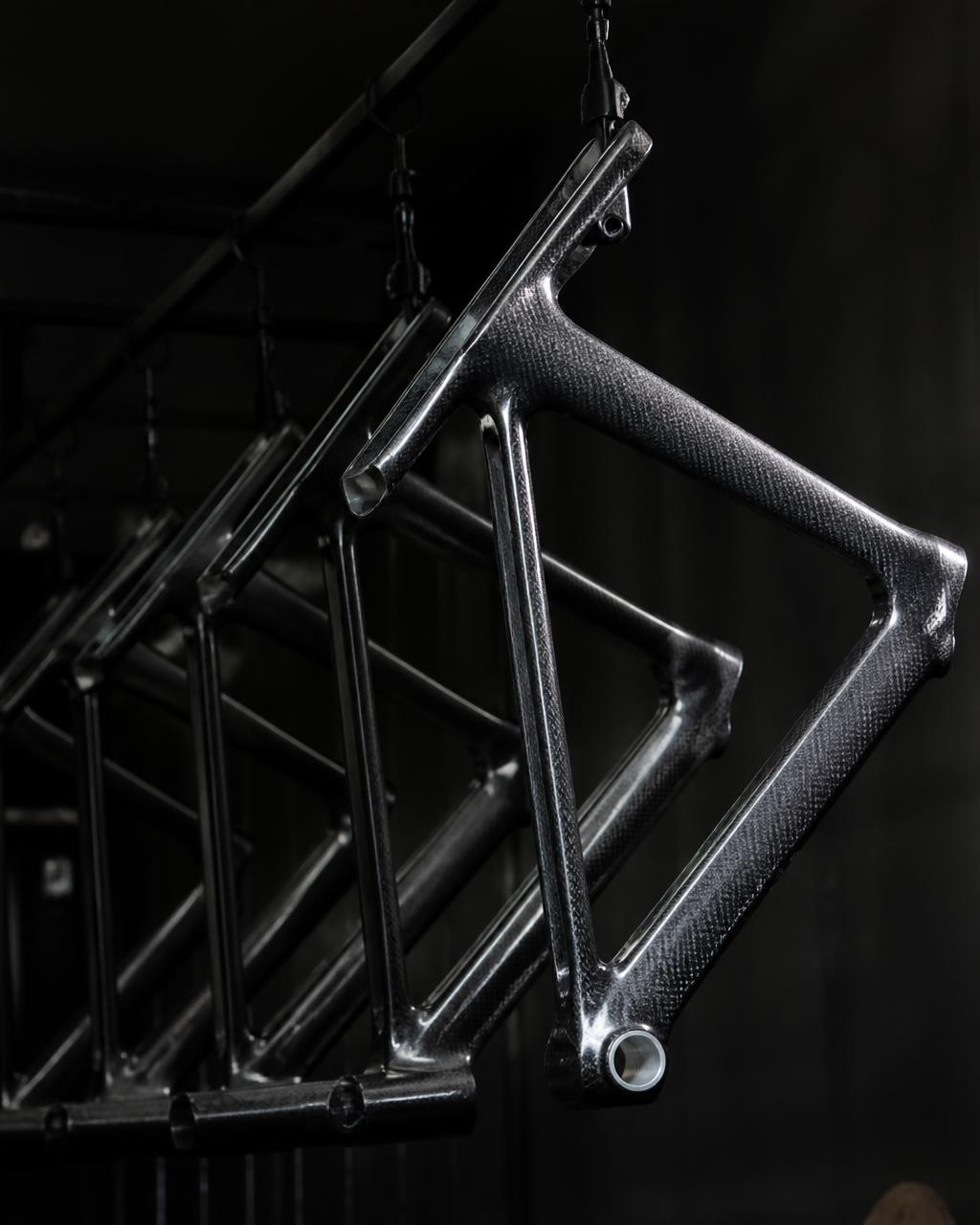 Complete bicycles and bare framesets lined up